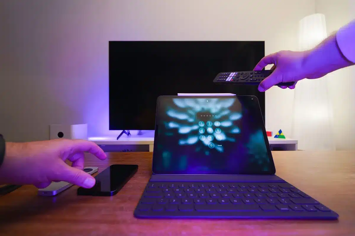 Smartphone screen locked with shield icon, hands attempting to unlock device, digital security visualization, protective barrier concept