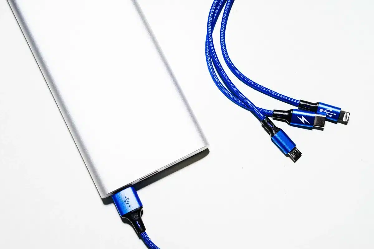 Portable power device with cables and display, compact size, ready for use