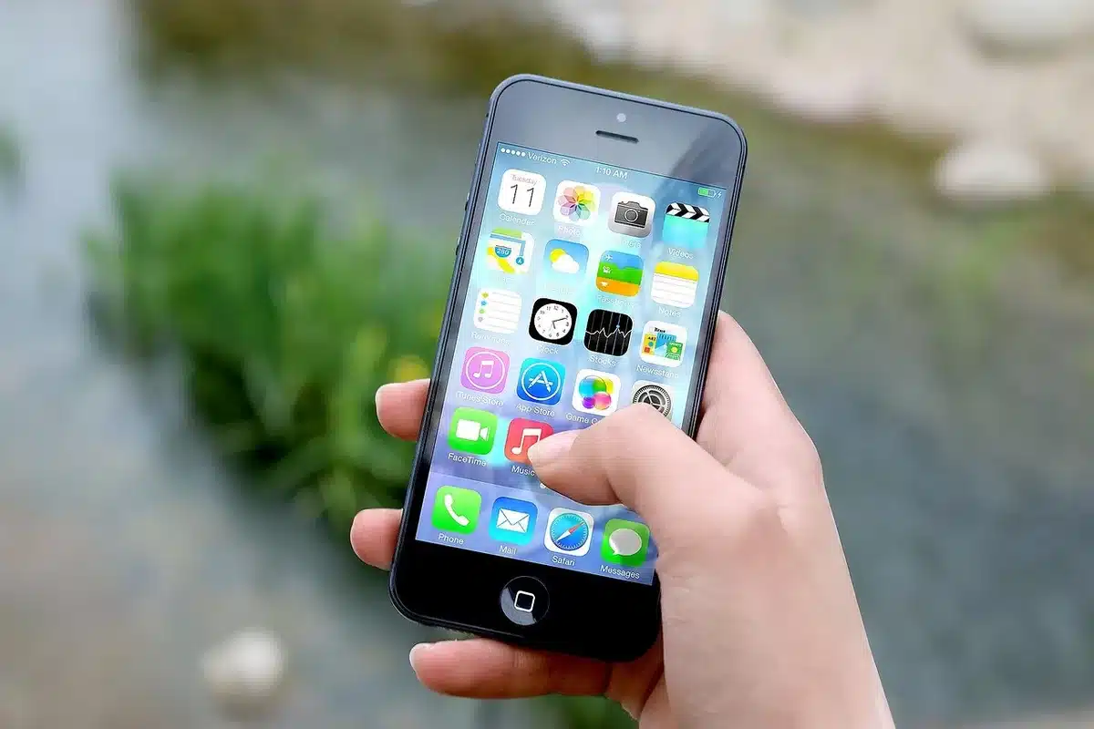 Detailed close-up of a smartphone display showing various performance test results and graphs in a redesigned interface with card-based layout organization.