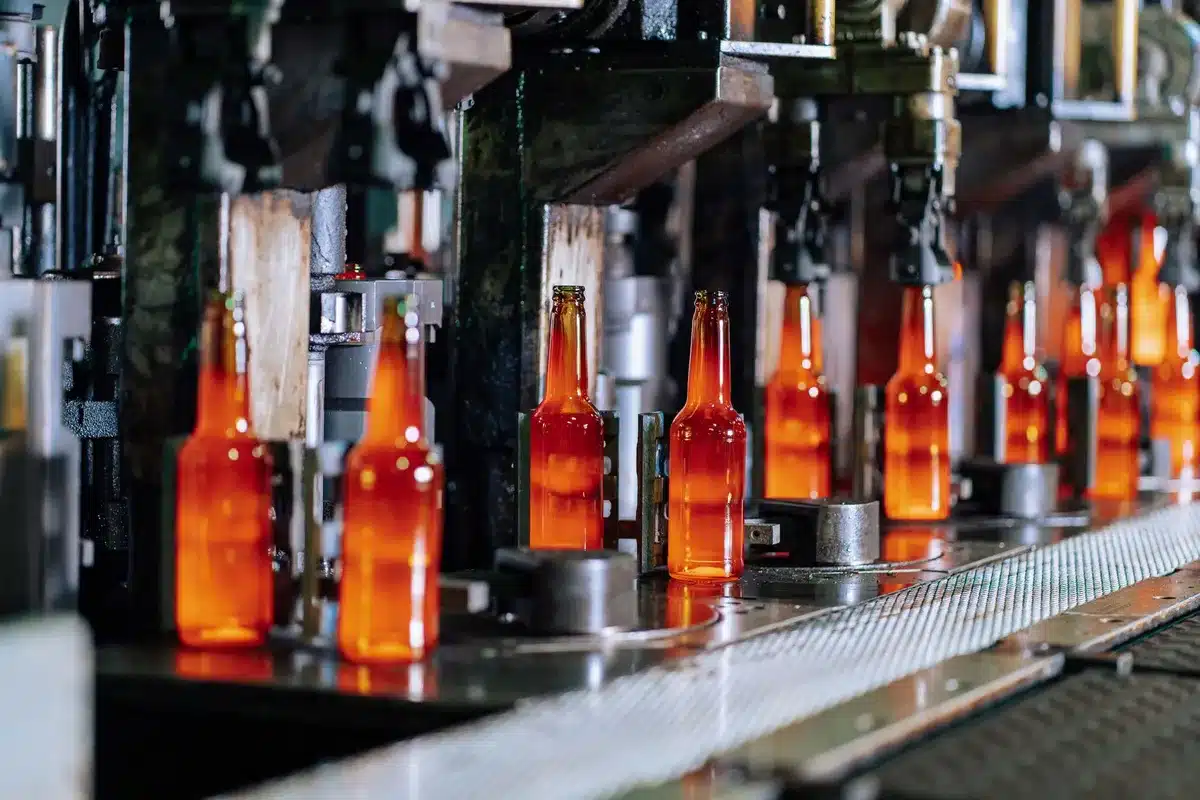 Empty modern factory floor with robotic arms and no workers, focused on a production line and conveyor belt, conveying industrial investment in Mexico