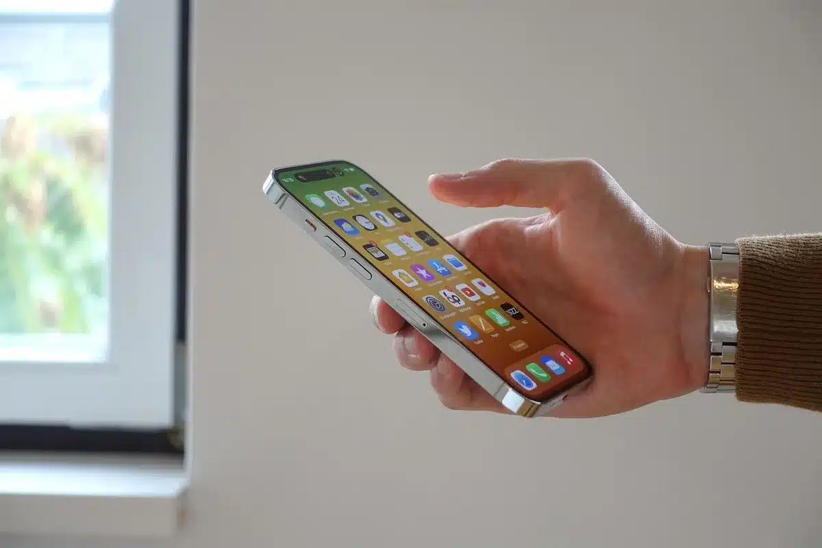 empty iPhone home screen with generic widgets and a blurred settings icon