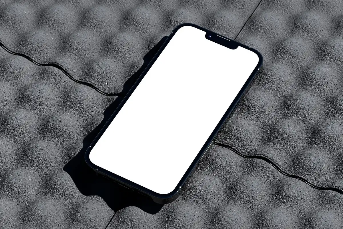 Sleek smartphone with large AMOLED display showing vibrant colors, thin bezels catching light, minimalist design