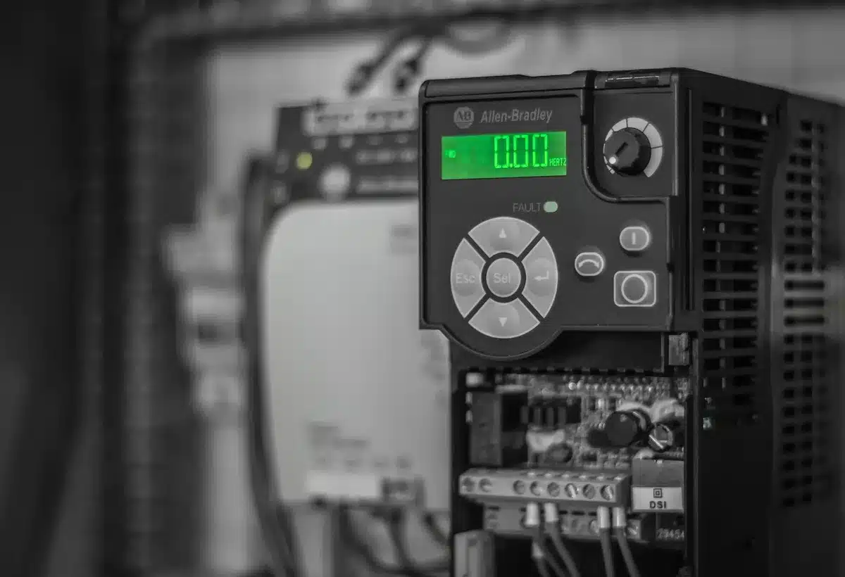 A close-up of the AI Control display panel on a Samsung washer-dryer, showing touch interface and cycle selection options, soft-focused background