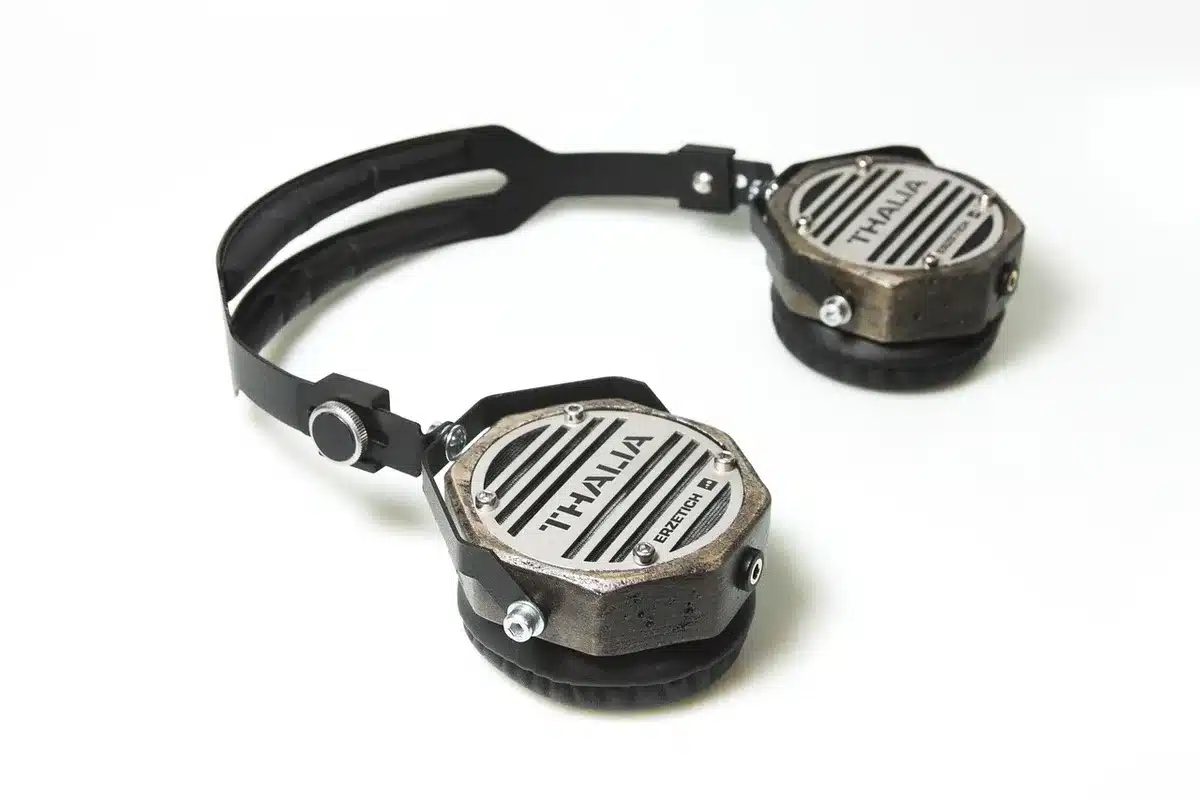 Premium over-ear headphones in white, angled view showing 40mm driver design and noise-cancelling microphone array, minimalist aesthetic with subtle metallic detailing