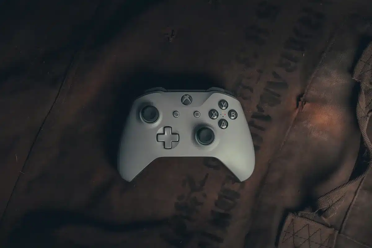 Scene of an empty retail shelf with a single generic gaming console box placed center, soft store lighting, price tag visible but unreadable